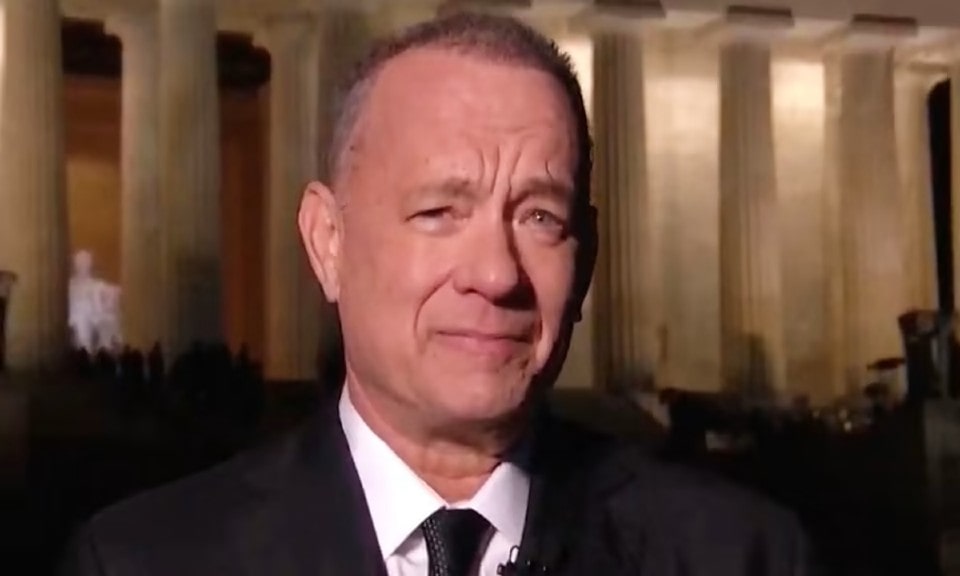 Tom Hanks breaks the news while clearly upset.